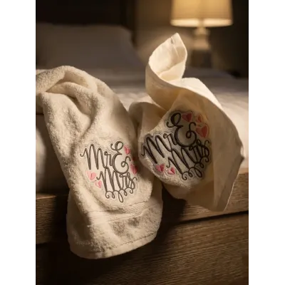 Mr & Mrs embroidery design stitched on white fabric showing romantic lettering pattern