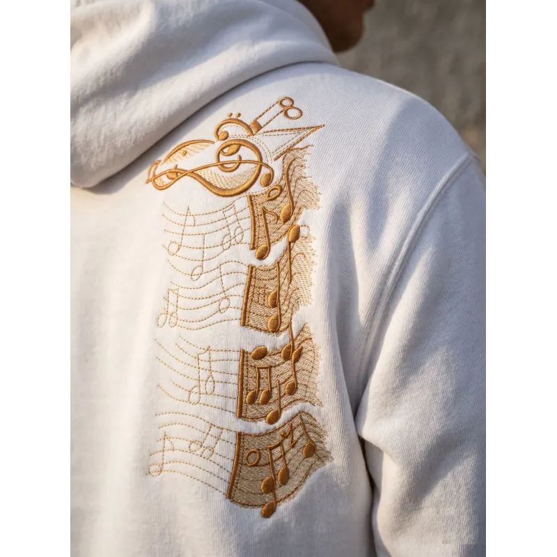 Music giraffe embroidery design with musical notes and playful giraffe illustration