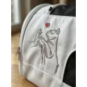 Friendship between cat and human embroidery design showing a cat and person bonding together