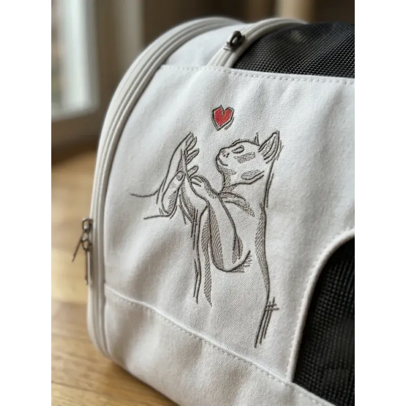 Friendship between cat and human embroidery design showing a cat and person bonding together