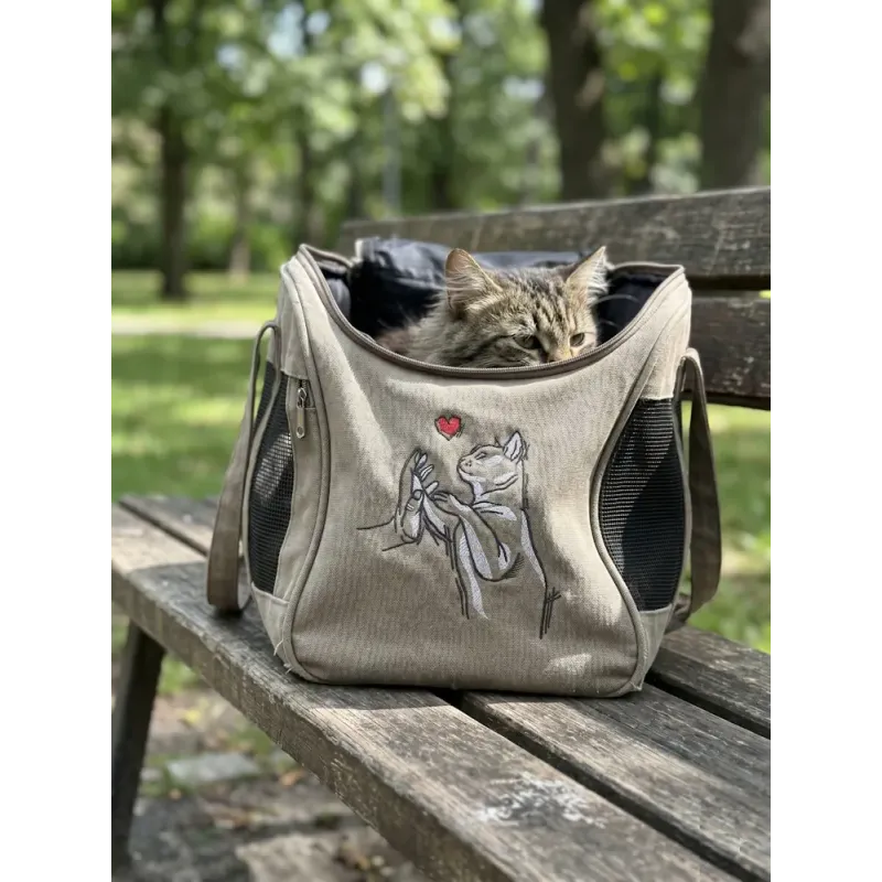 Friendship between cat and human embroidery design showing a cat and person together