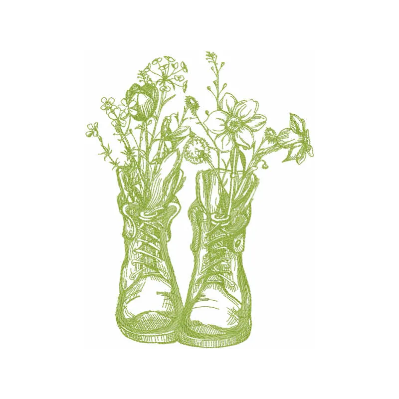 Embroidery design featuring two old boots surrounded by vibrant flowers in a garden setting.