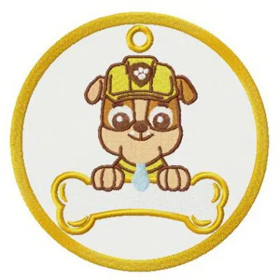 Rubble badge embroidery design featuring a playful motif from Paw Patrol, perfect for enhancing apparel and accessories.