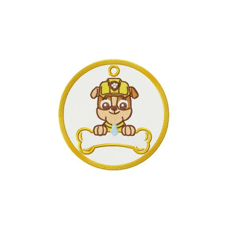 Rubble badge embroidery design featuring a playful motif from Paw Patrol, perfect for enhancing apparel and accessories.