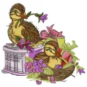 Embroidery design of adorable ducklings surrounded by violets, perfect for stitching on baby items or home decor.