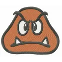 Goomba head embroidery design showcasing a whimsical character from Super Mario, ideal for fun projects.