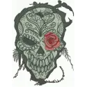 Skull with rose embroidery design showcasing intricate details, ideal for embellishing apparel and accessories.
