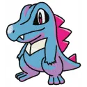 Totodile embroidery design featuring a playful Pokémon character, ideal for stitching on t-shirts and hoodies.